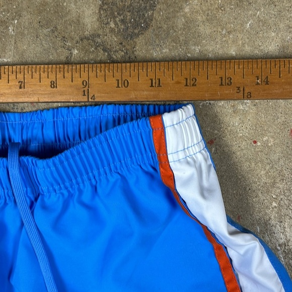 Vintage Nike Cropped Blue Pants with Orange and White Stripes
Size: small - Picture 6 of 7